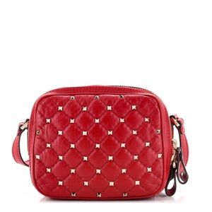Gently used authentic Valentino Garavani Rockstud, quilted leather camera bag.
